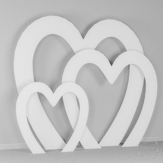 Set of three open white heart-shaped arches. Romantic photo backdrop for Valentine's events, weddings, anniversaries, and bridal showers.
