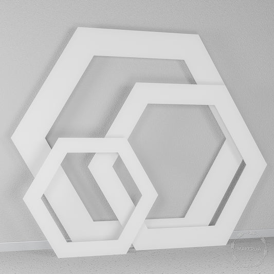 Set of three thick white wooden hexagonal open frames. Modern geometric backdrop for trendy weddings, photo booths, and corporate event styling.