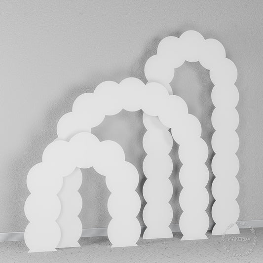Set of three white arches featuring a playful wavy, scalloped edge design. Cloud-like backdrop for whimsical baby showers and children's birthdays.