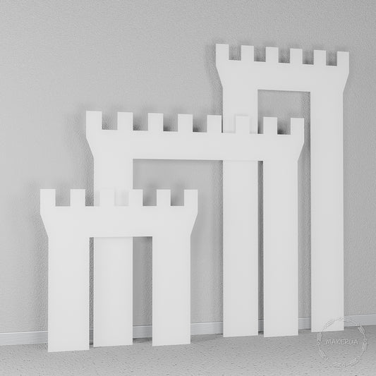 White wooden castle wall backdrop with detailed tower battlements. Large fairytale photo booth prop for royal themed parties and events.