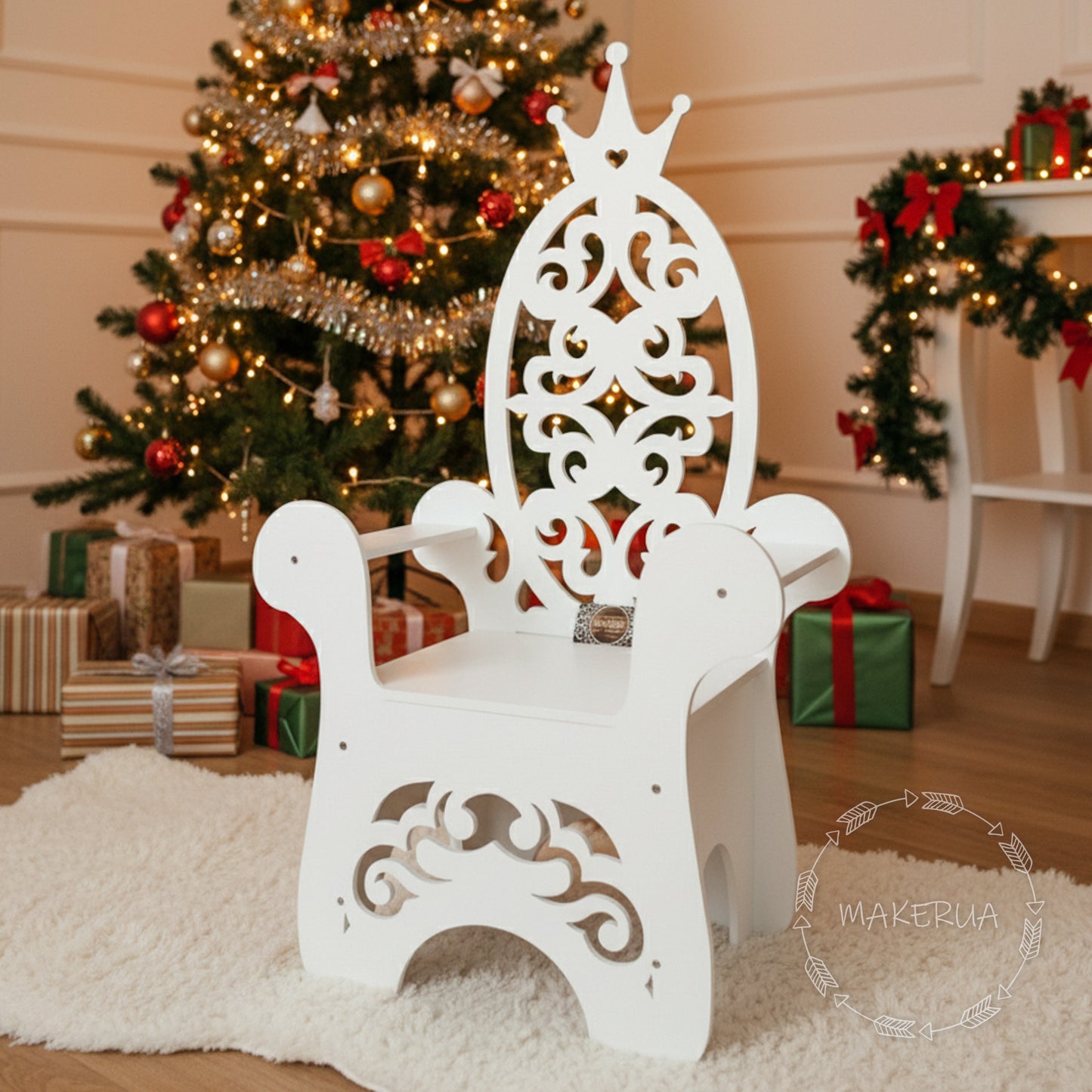 White wooden throne chair featuring an intricate filigree backrest and a small heart detail. Styled in a festive room with a Christmas tree and gifts. Elegant seating photo prop for kids' birthday parties and holiday events.