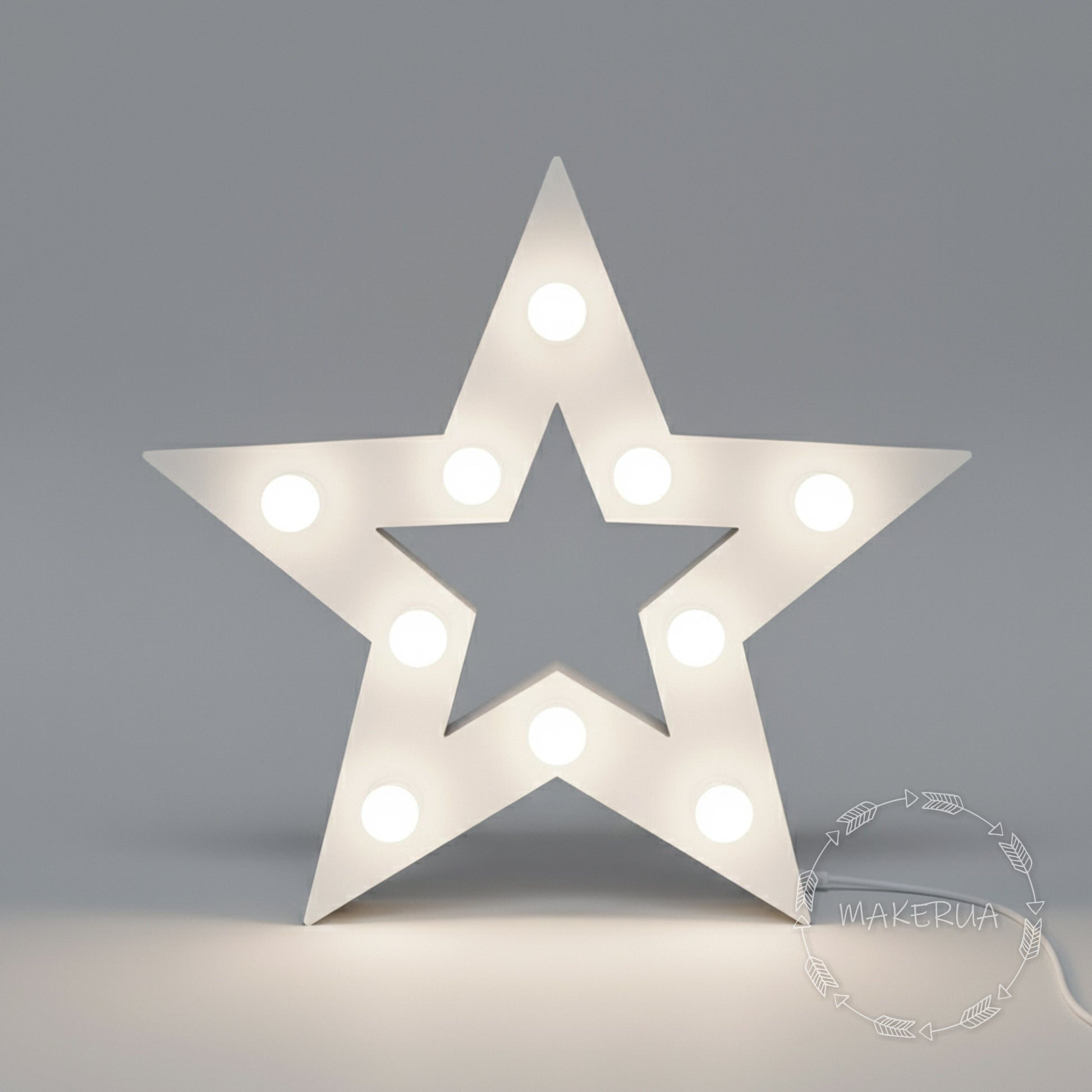 Star-shaped light fixture with bulbs on a gray background